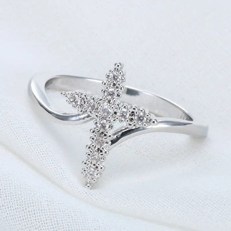 El Anillo de la Gloria — Cruz de plata con detalles de cristal
