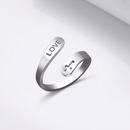 El anillo de la compasión — Cruz con detalle de amor (ajustable)