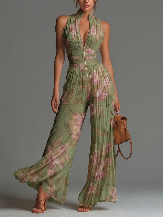 Mono de gasa verde con estampado floral, cuello en V, sin mangas, cierre al frente, plisado y pierna ancha