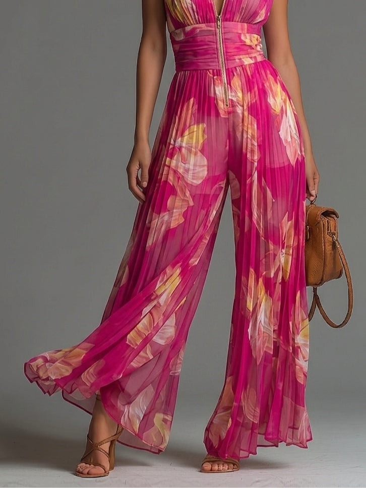 Mono de gasa fucsia con estampado floral, sin mangas, con cremallera, detalles plisados y pantalones de pierna ancha