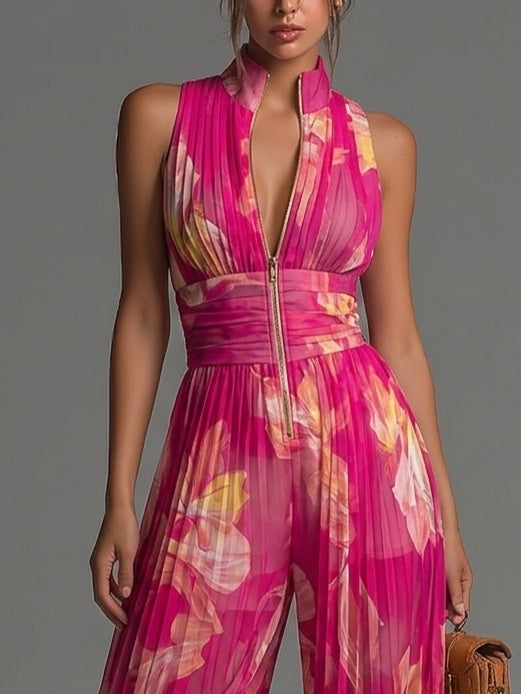 Mono de gasa fucsia con estampado floral, sin mangas, con cremallera, detalles plisados y pantalones de pierna ancha