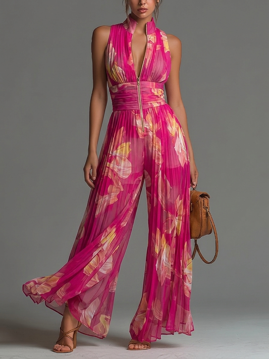 Mono de gasa fucsia con estampado floral, sin mangas, con cremallera, detalles plisados y pantalones de pierna ancha