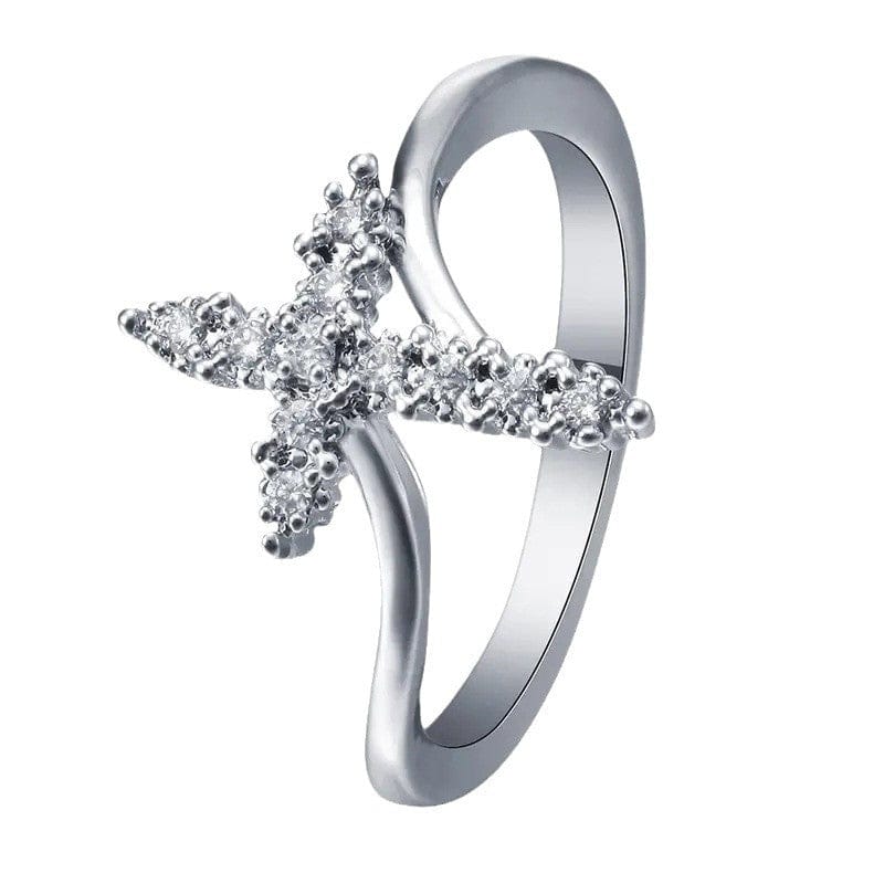 El Anillo de la Gloria — Cruz de plata con detalles de cristal