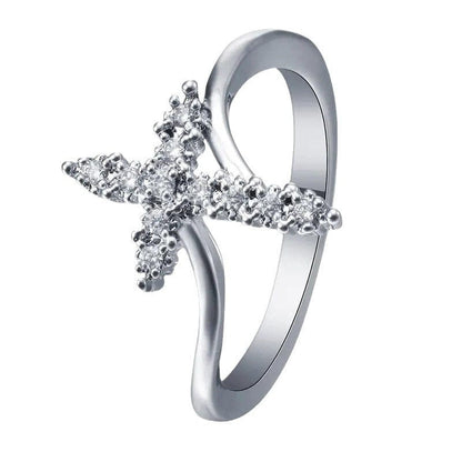 El Anillo de la Gloria — Cruz de plata con detalles de cristal